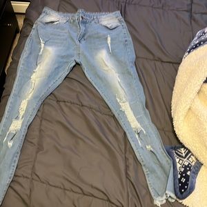 Stretchy blue jeans, ripped, and distressed